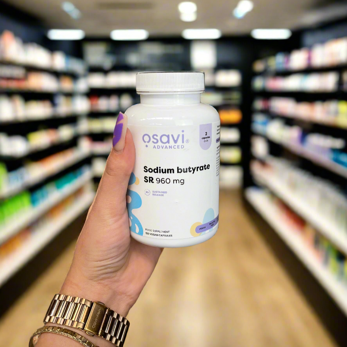 Close-up of (Osavi Sodium butyrate SR, 960mg - 120 vegan capsules) held up inside My Supplement Shop, clearly showing the front label in a Sports Nutrition setting.