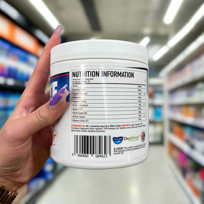 Close-up of (Per4m Hydration Electrolyte Mix 30 Servings) held up inside My Supplement Shop, clearly showing Nutritional Values on the packaging in a Sports Nutrition setting.
