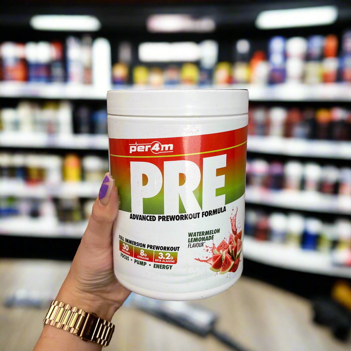 Close-up of (Per4m Pre Workout Stim 570g 30 Servings) held up inside My Supplement Shop, clearly showing the front label in a Sports Nutrition setting.